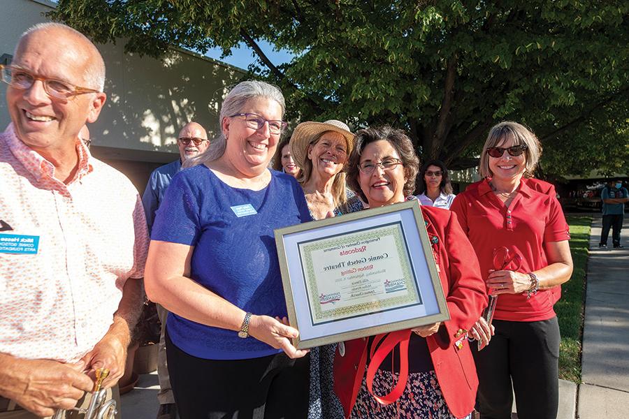 The Farmington Chamber Redcoat Ambassadors presented a plaque to the Connie Gotsch Arts Foundation. Cathy Pope, Foundation Treasurer accepting, at left.